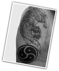 BDSM tattoo - Tiger with triskele